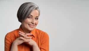 Woman with short grey hair, smiling