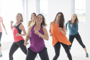 A group of women having fun, taking a dance fitness class. How Dance Prevents Osteoporosis