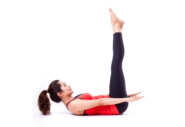 woman doing yoga Upward Extended Feet Pose for core exercises