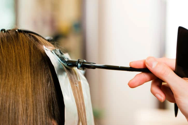 At the hairdresser ? woman gets new hair colour
