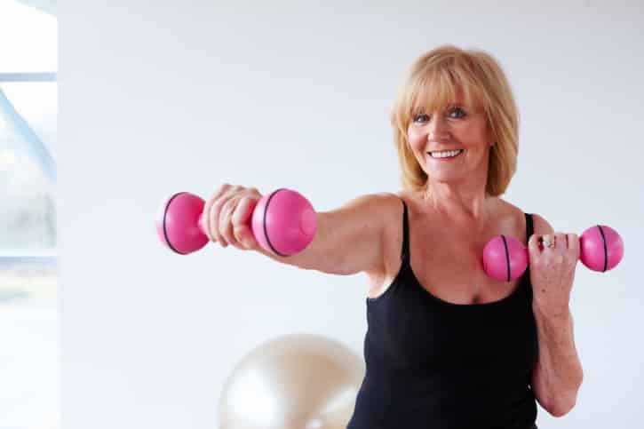 Senior Woman Training with Weights