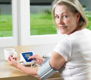 Woman taking blood pressure