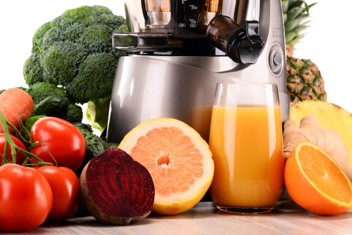 juicer with organic fruits and vegetables