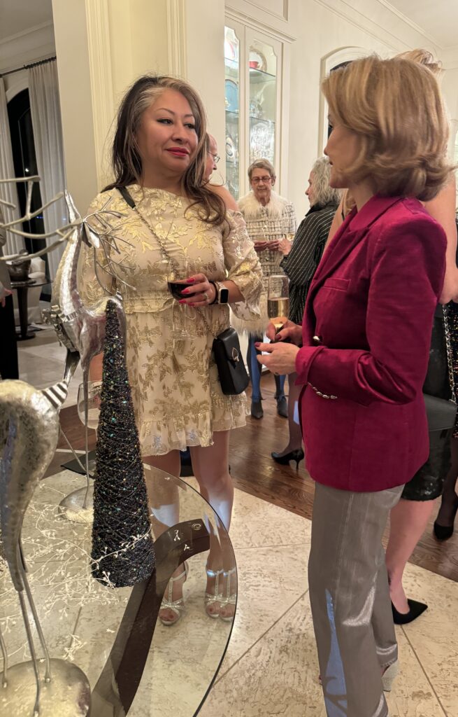 Furthering your Christmas Presence, Dorthy with guest at party