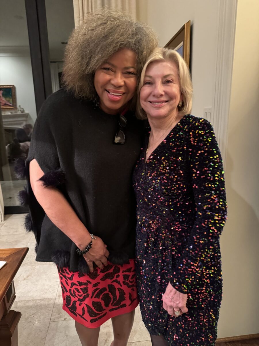 Furthering your Christmas Presence, Valerie with guest at party