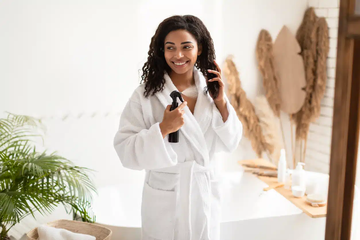 Woman using a hair protectant