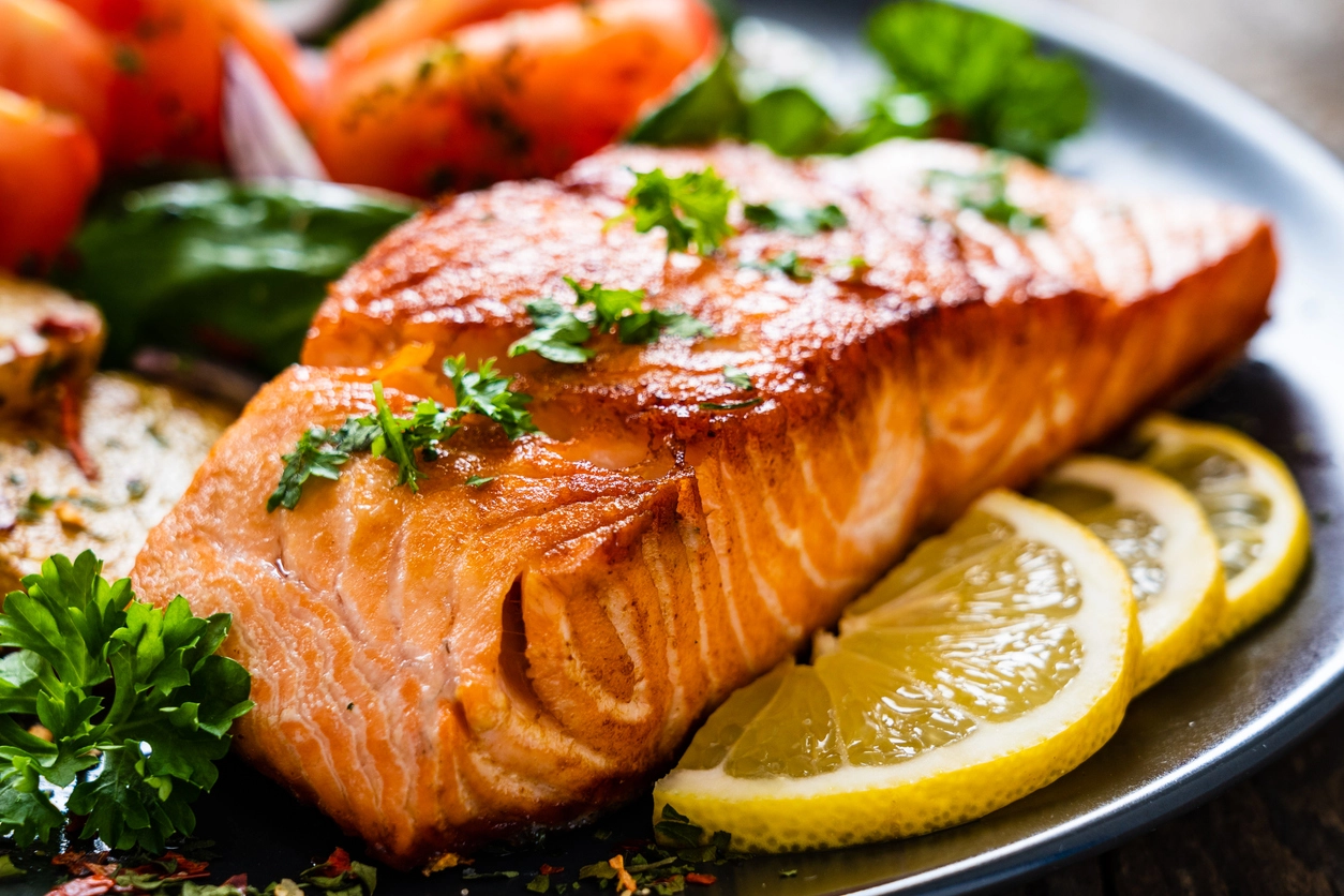 Grilled salmon on a bed of vegetables
