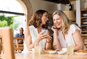 Ladies laughing at phone