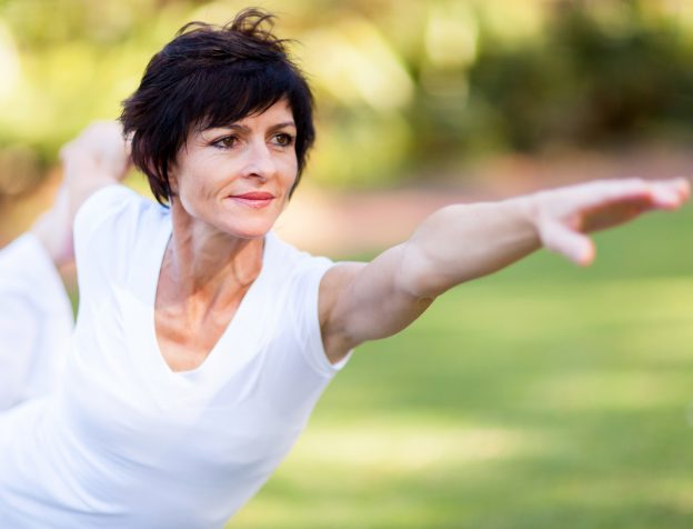 healthy middle aged woman stretching