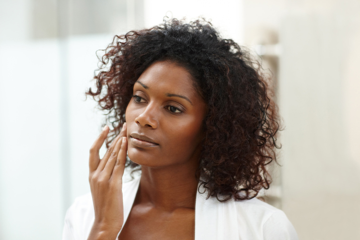 Woman applying anti-aging skin cream