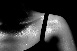 Silhouette of a woman sweating