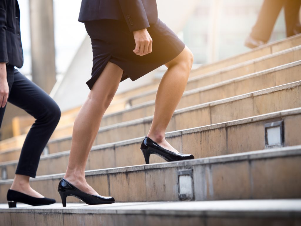 Woman Walking Up Stairs