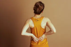 Woman Experiencing Lower Back Pain. 4 Exercise Mistakes That Could Harm Your Lower Back