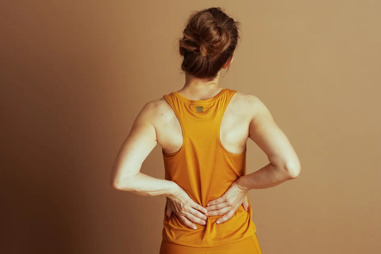 Woman Experiencing Lower Back Pain. 4 Exercise Mistakes That Could Harm Your Lower Back