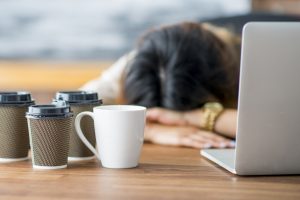 Tired Woman and crashing fatigue from menopause