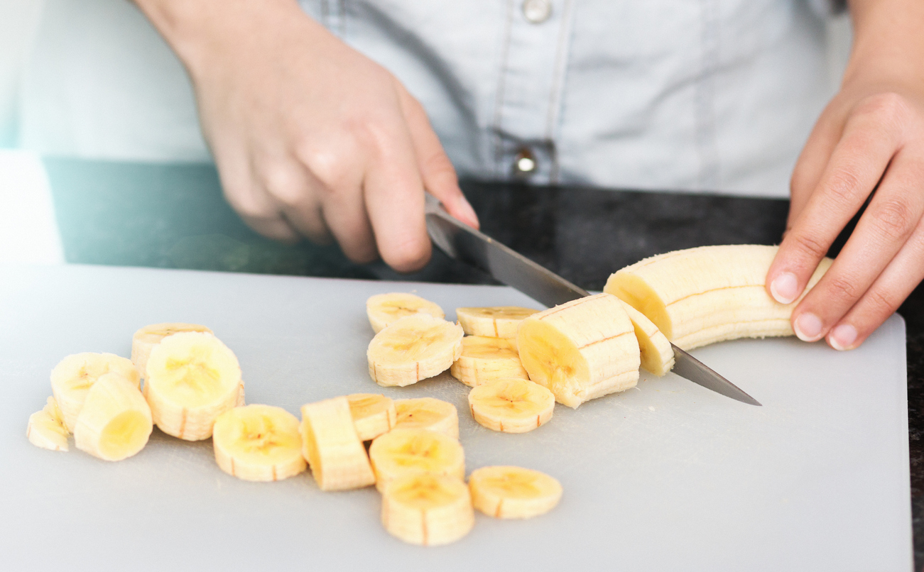 Woman Slicing Banana