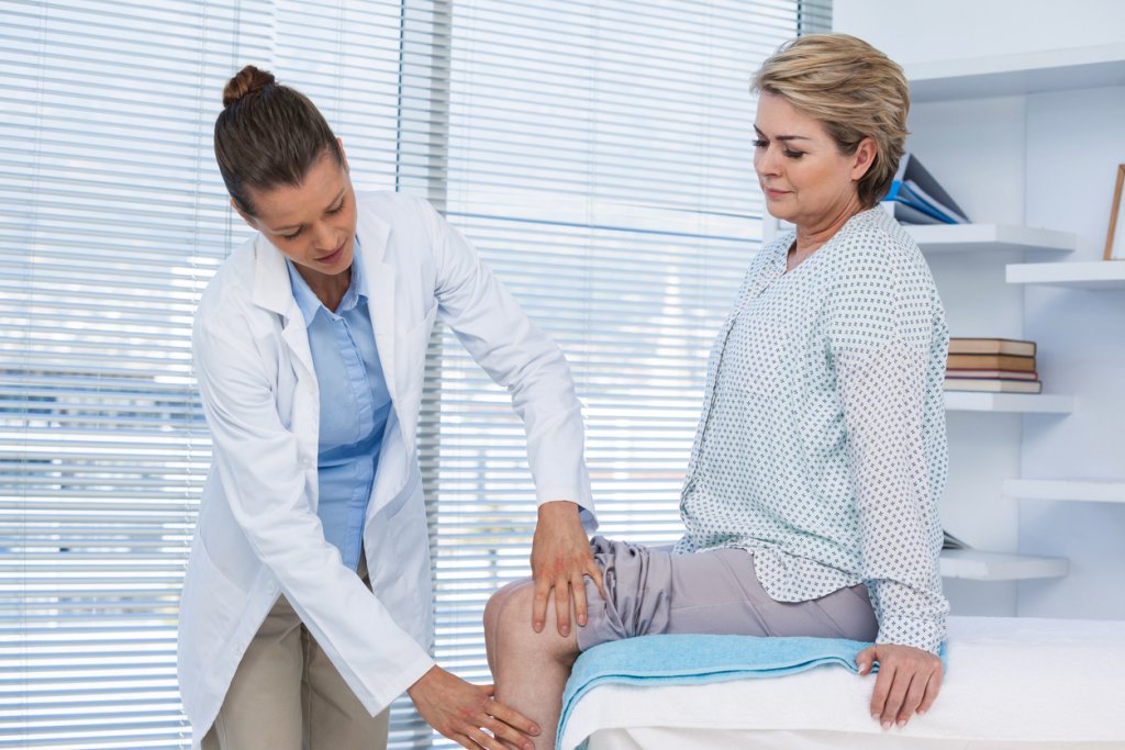 Doctor Examining Knee