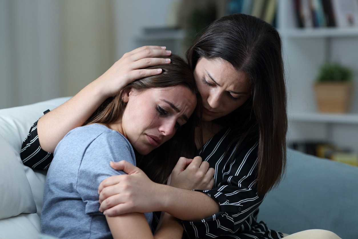 Woman crying to friend pity party