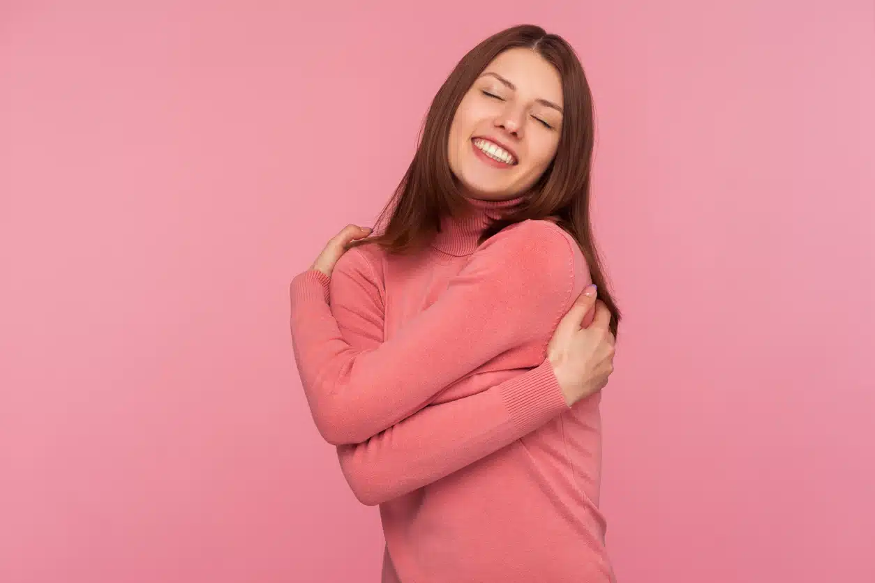 Woman hugging herself, narcissist 