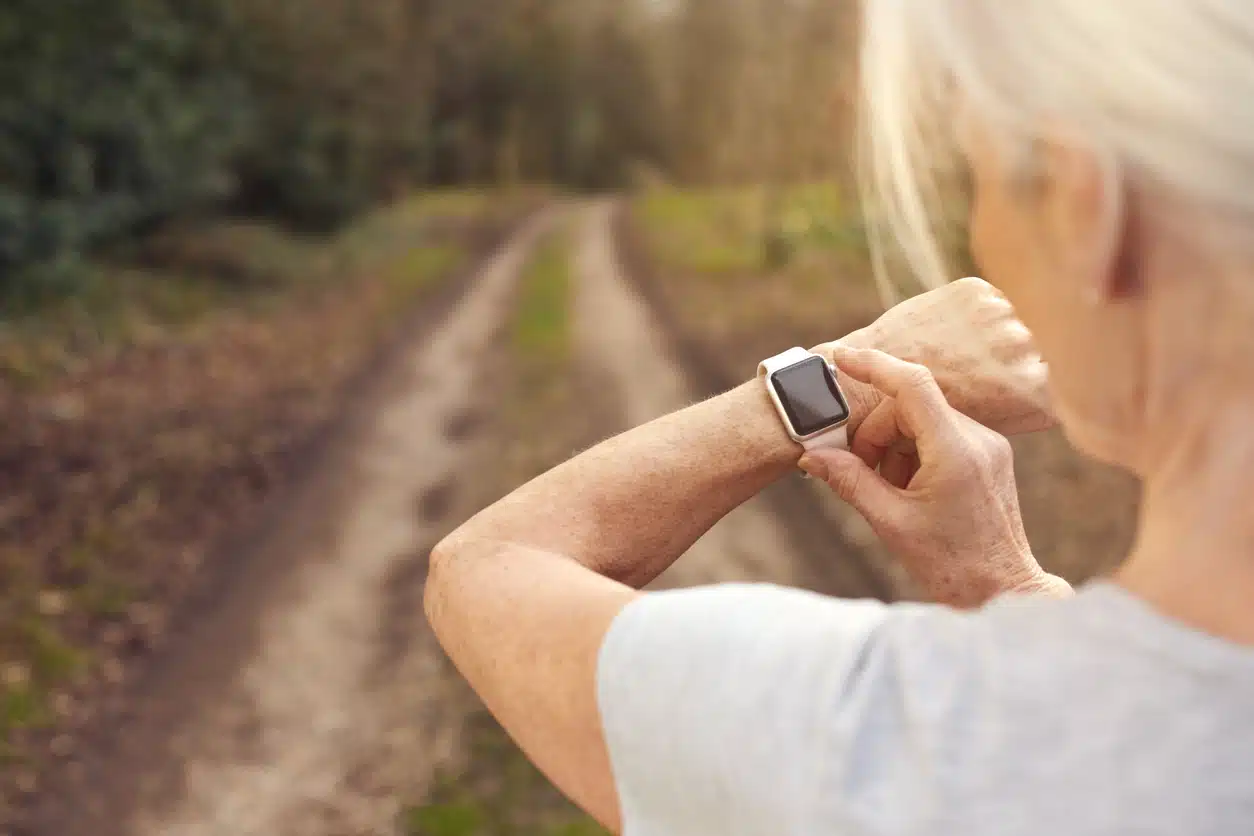 Woman looking at fitness watch