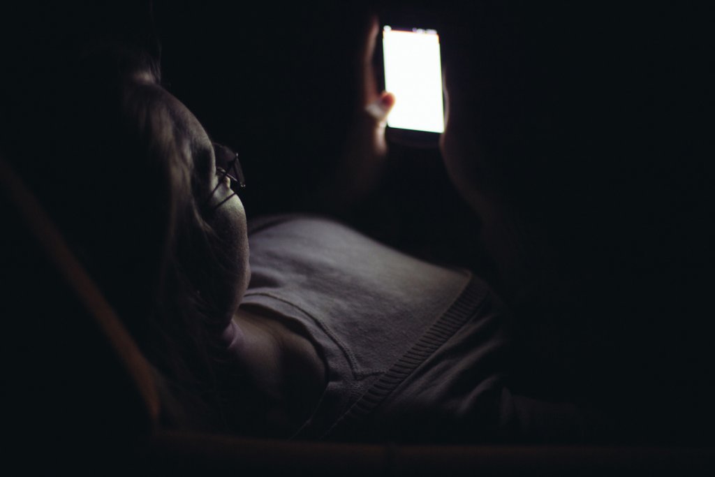 Woman Looking at Phone Screen