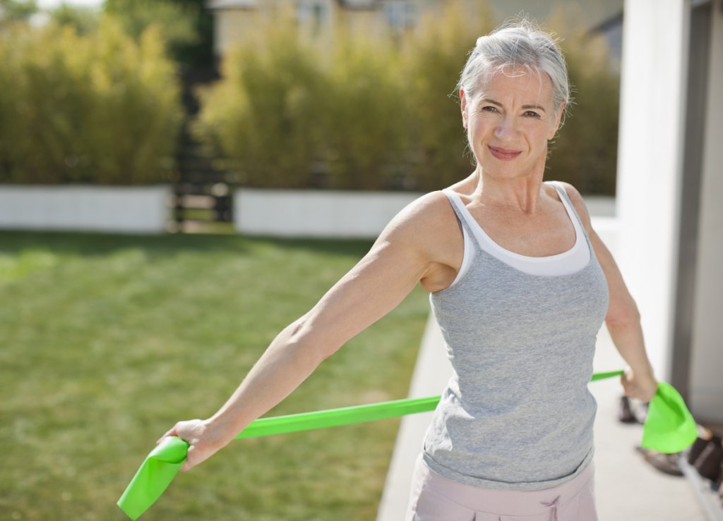 Woman Using Resistance Bands
