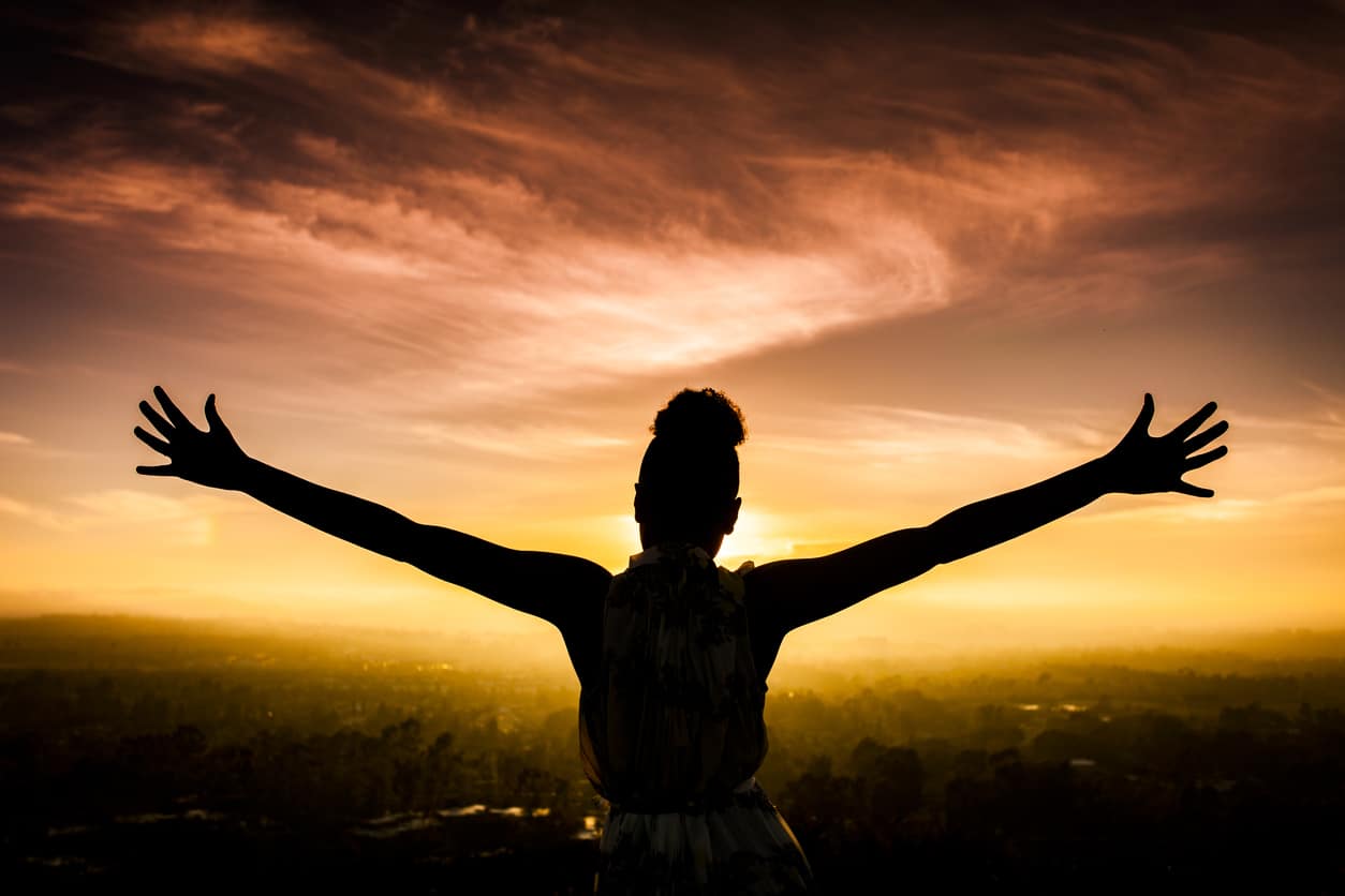 Woman celebrating accomplishments and new years resolutions