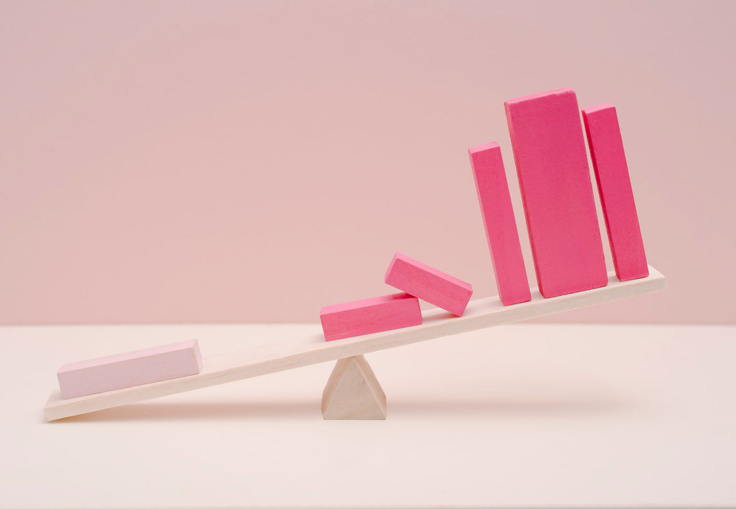 pink blocks on a seesaw