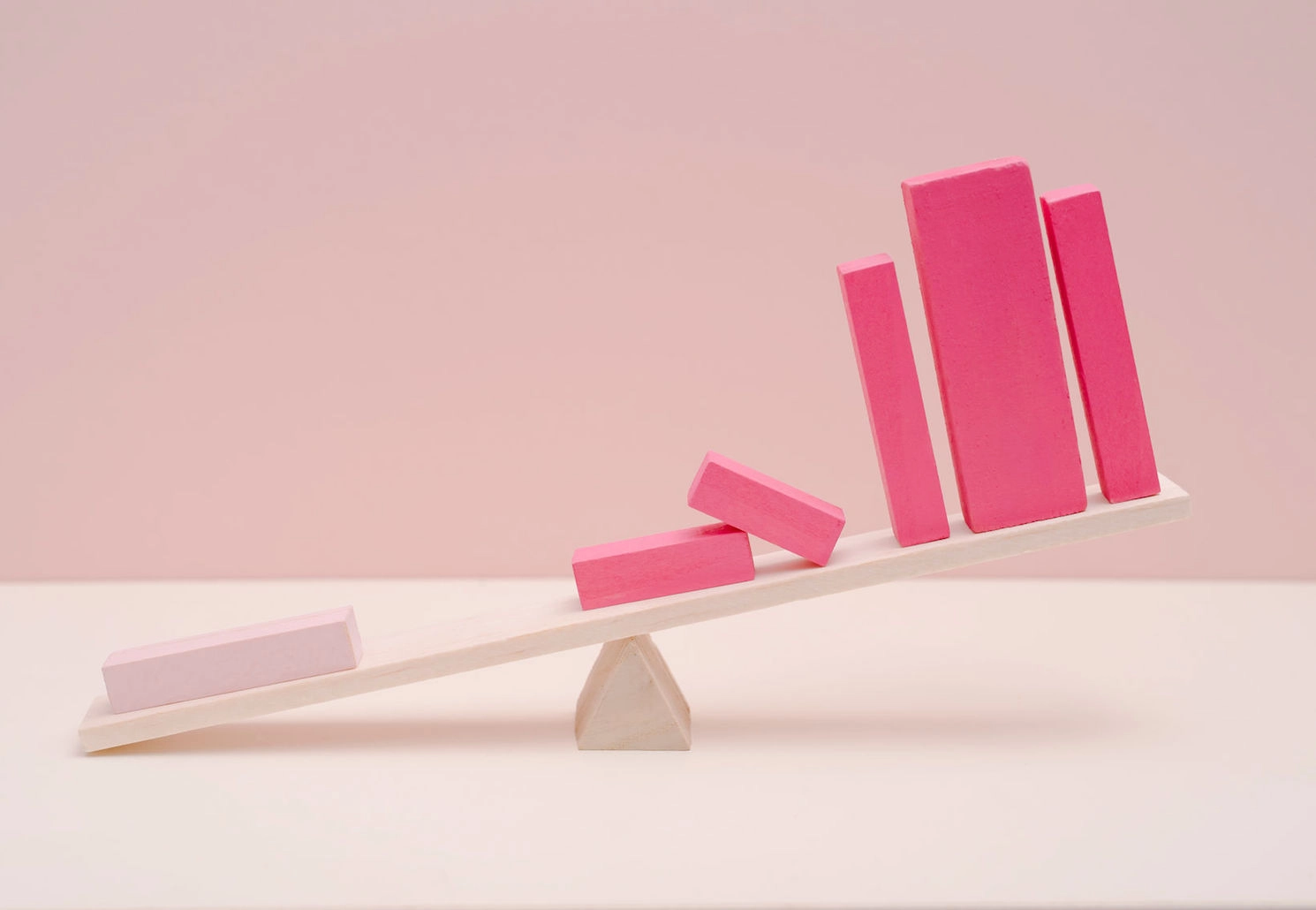 pink blocks on a seesaw