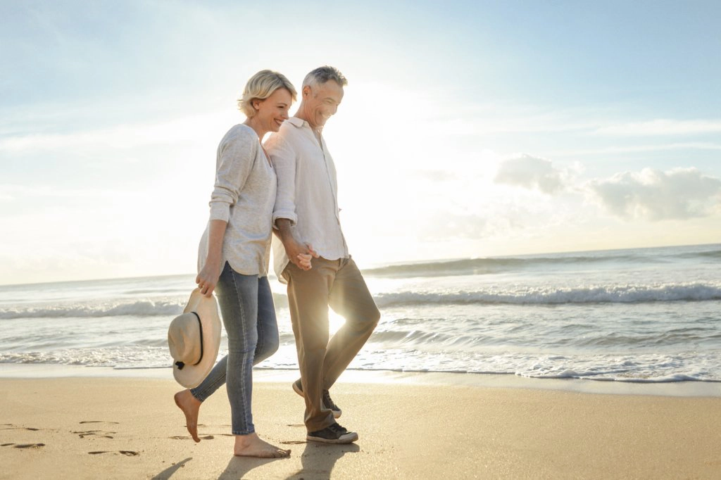 Mature Couple Walking the Beach