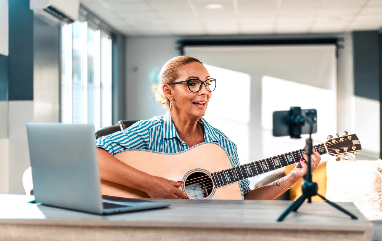 Woman singing and recording herself