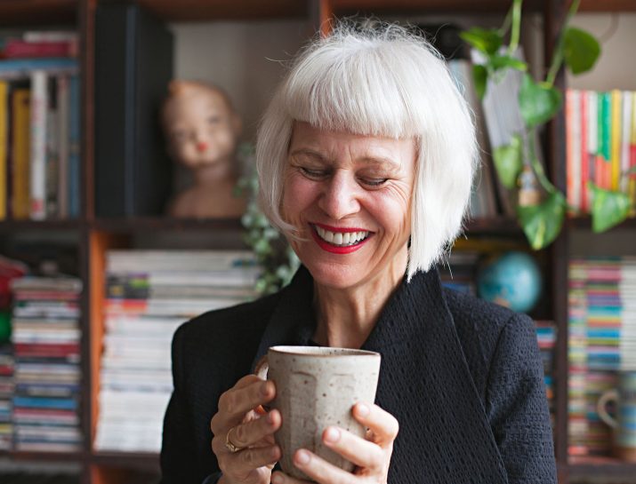 white haired woman laughing