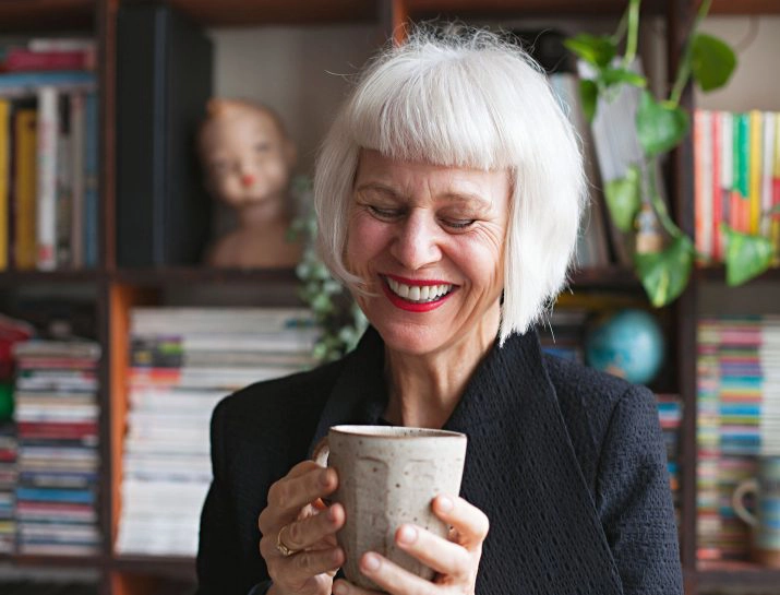 white haired woman laughing