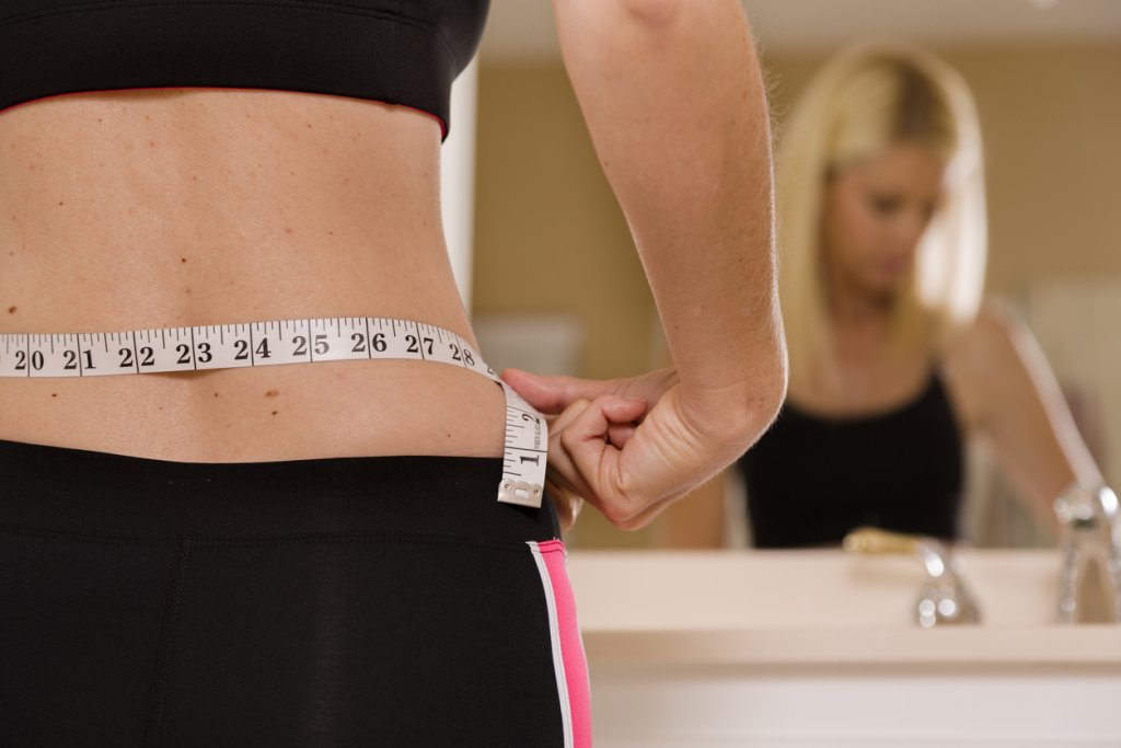 Woman Measuring Waist