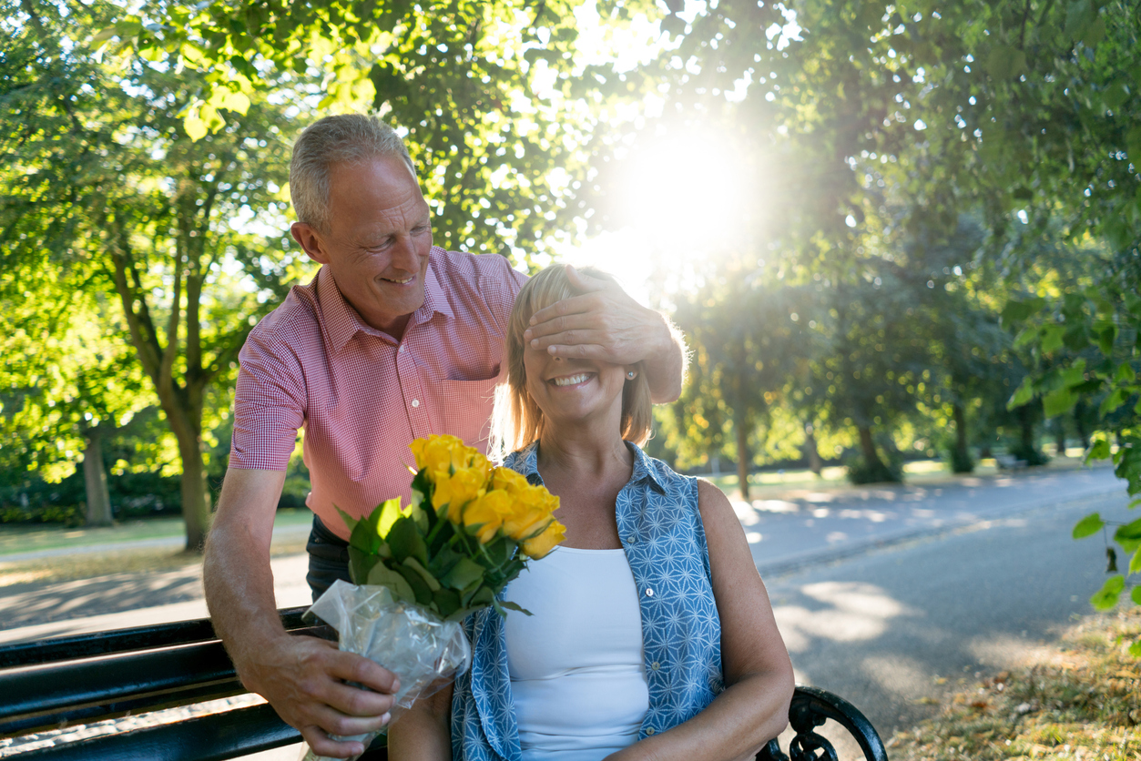 Man Giving Woman Flowers