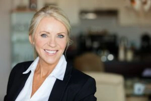 Professional hairstyles for mature women - woman in an office in business attire