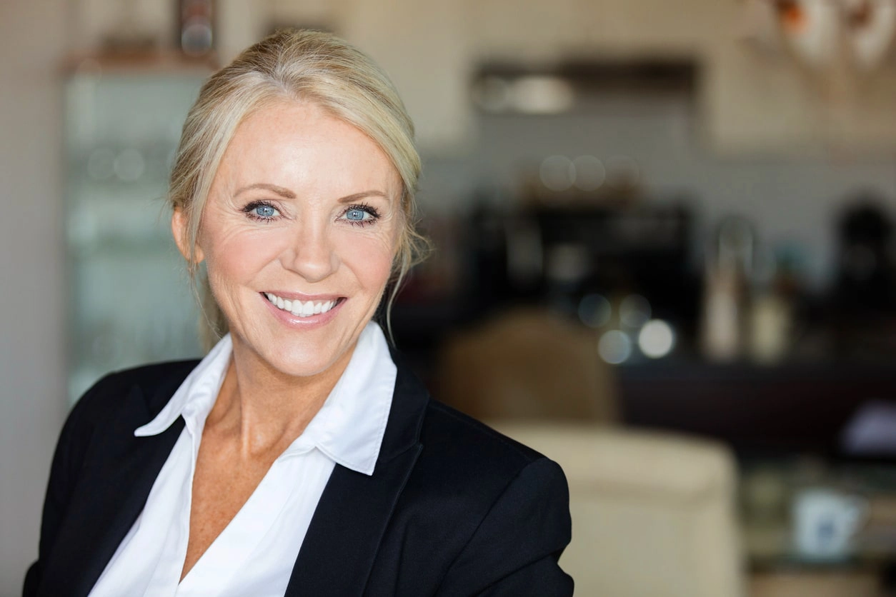 Professional hairstyles for mature women - woman in an office in business attire