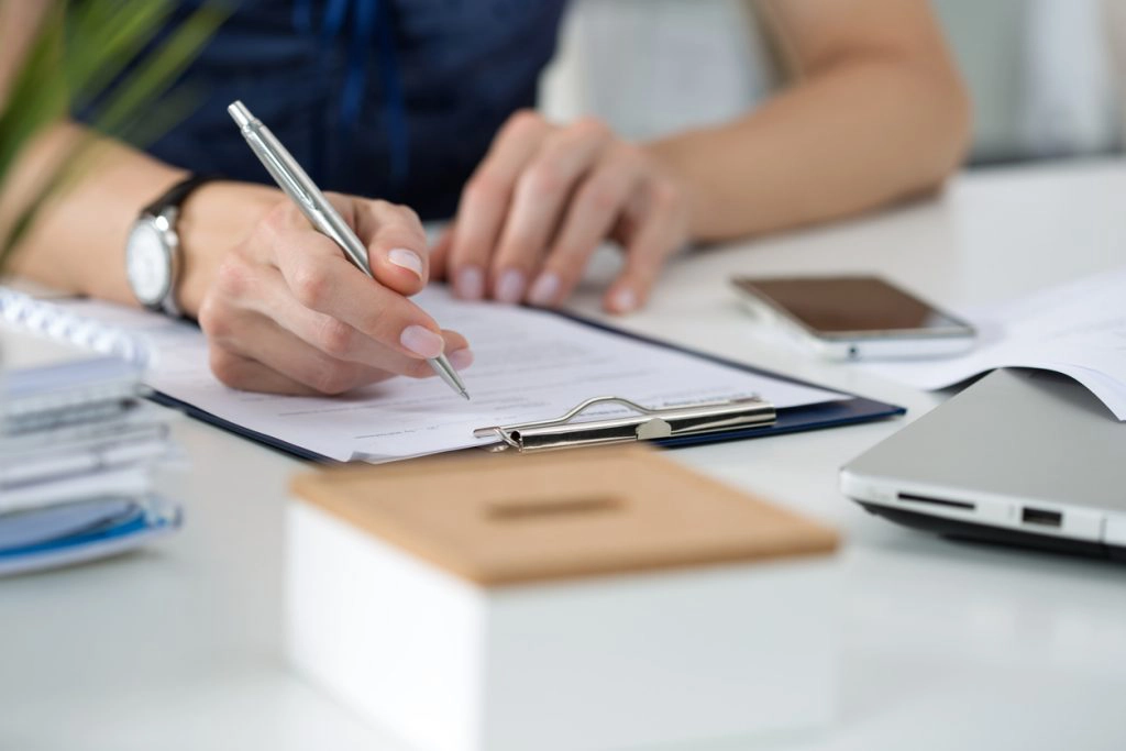 Woman over 50 signing contract commitment life change
