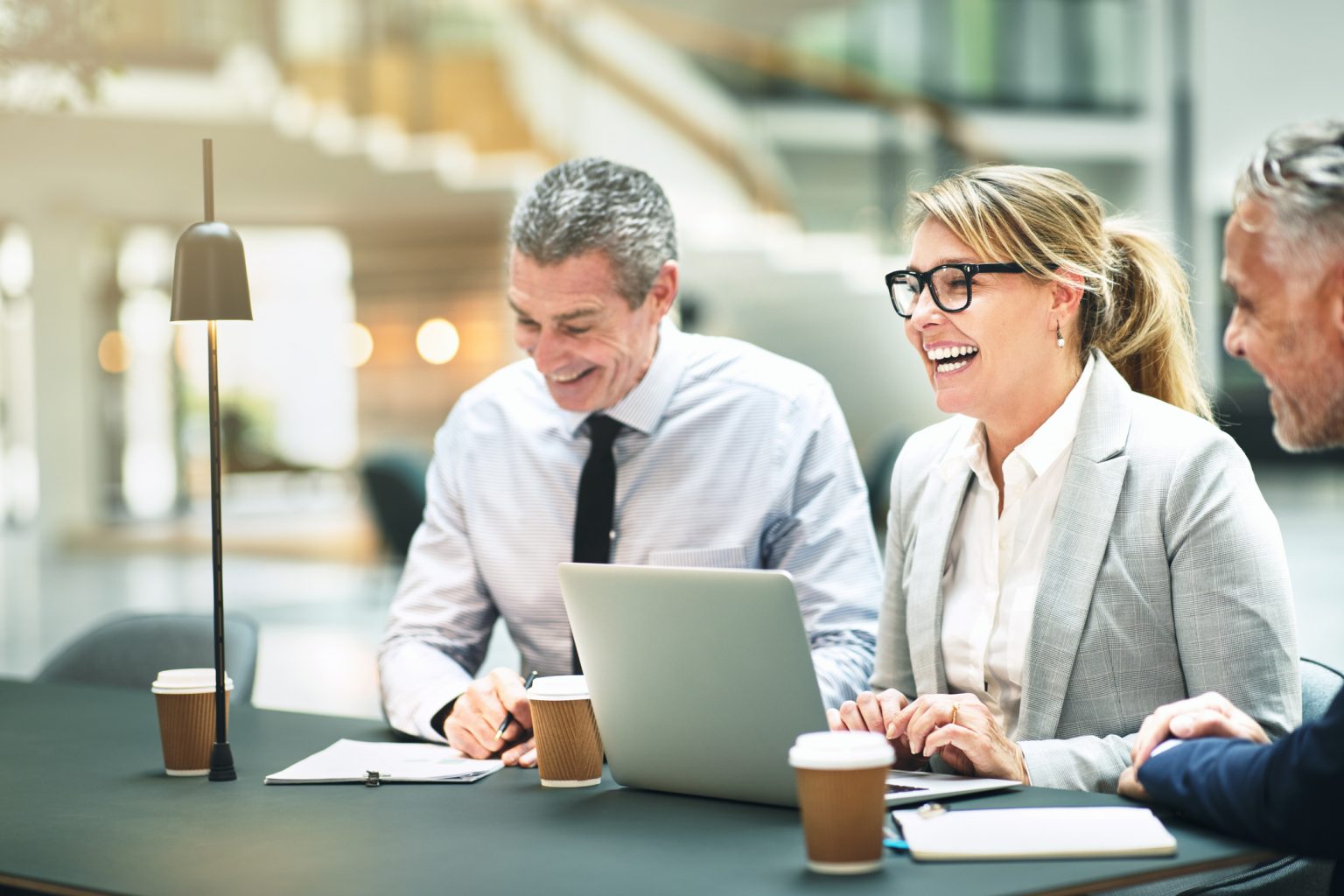 Business innovation colleagues brainstorming while sitting together at an office table