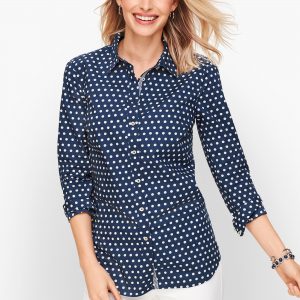 A button down long sleeve shirt makes a classic transition piece 