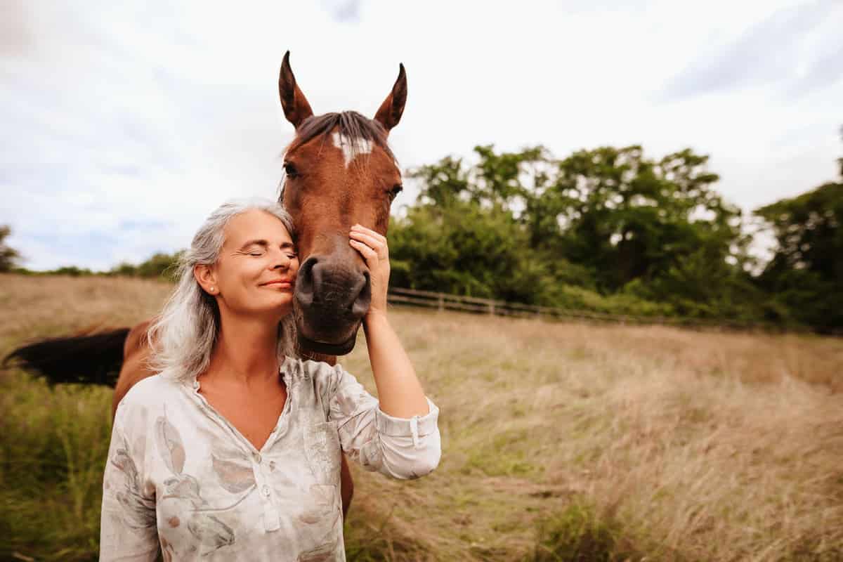 Woman hugging a horse