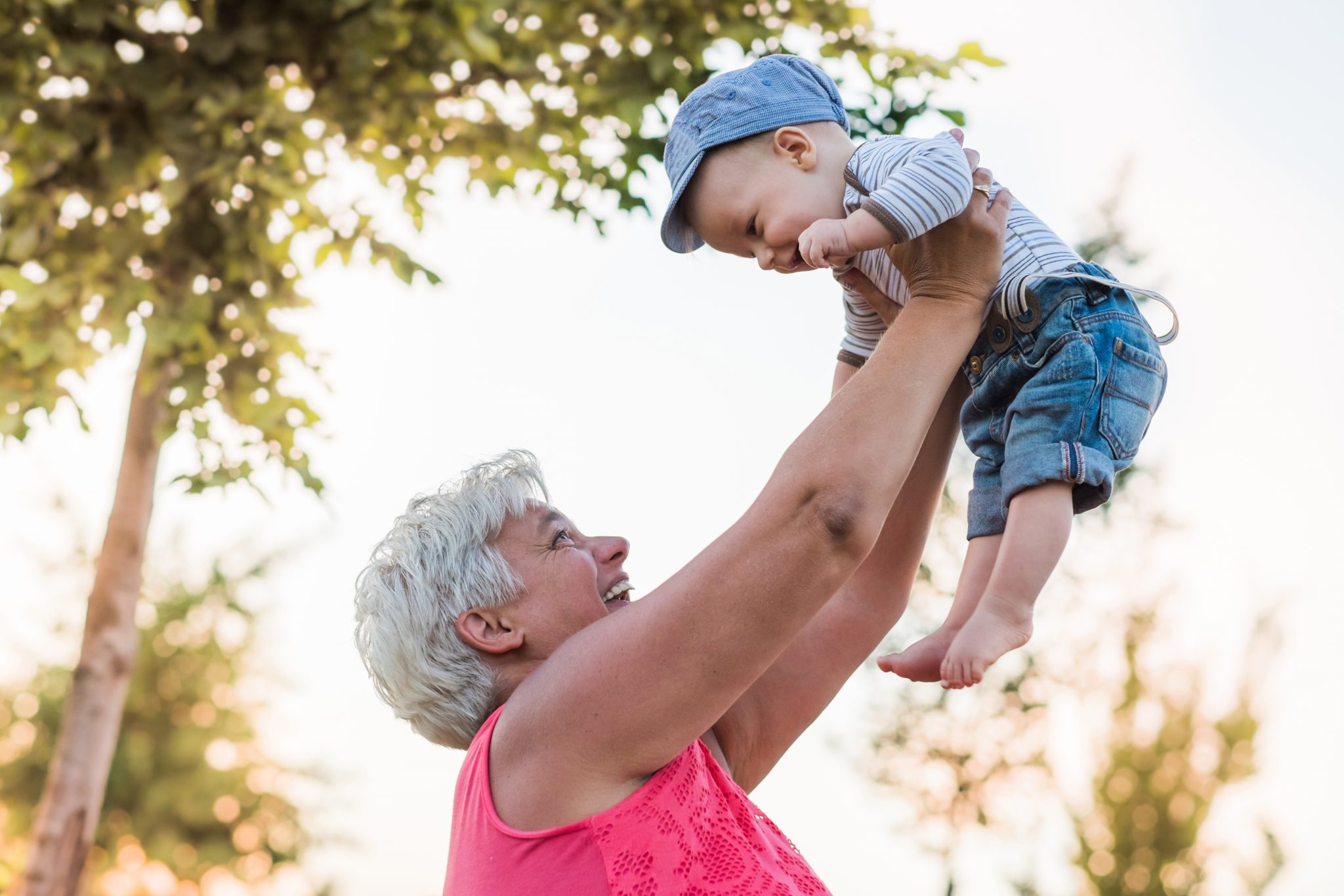 GRANDPARENTING TIPS grandmother is playing with baby in park