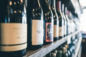 Savvy wine shoppers know to chat with the store salespeople. 