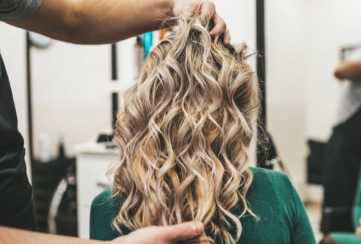 tame curly hair frizz