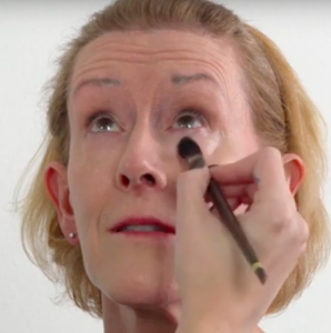 Showing how to apply concealer for women over 50
