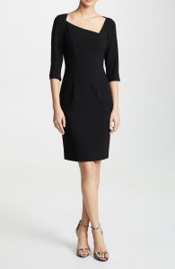 The asymmetrical neckline adds visual interest to this classic dress. 