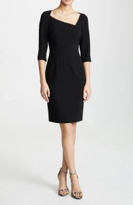 The asymmetrical neckline adds visual interest to this classic dress. 