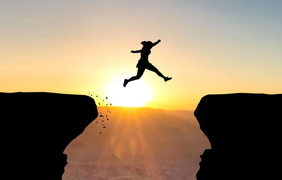 Woman leaping, taking a chance