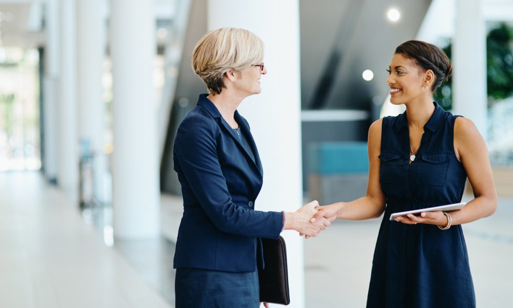 women in the workplace helping each other
