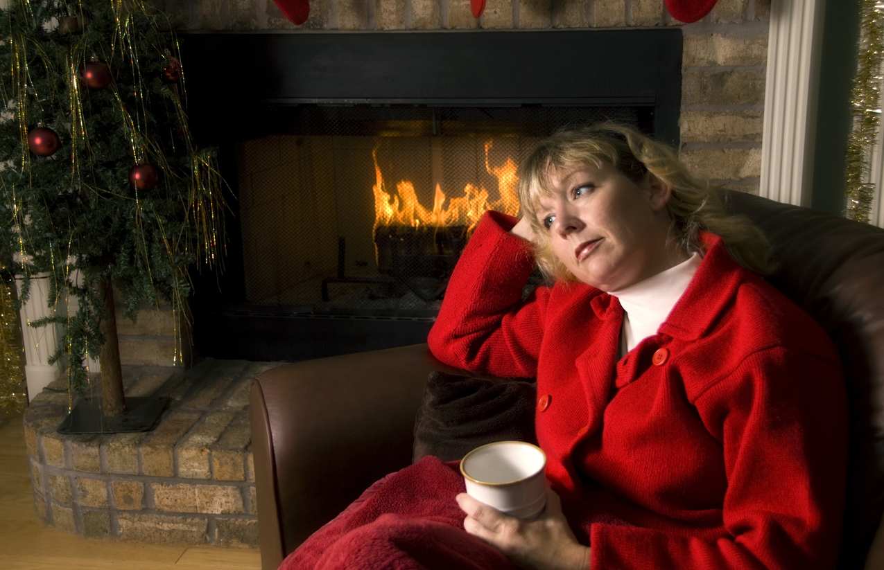 woman resting by the fireplace